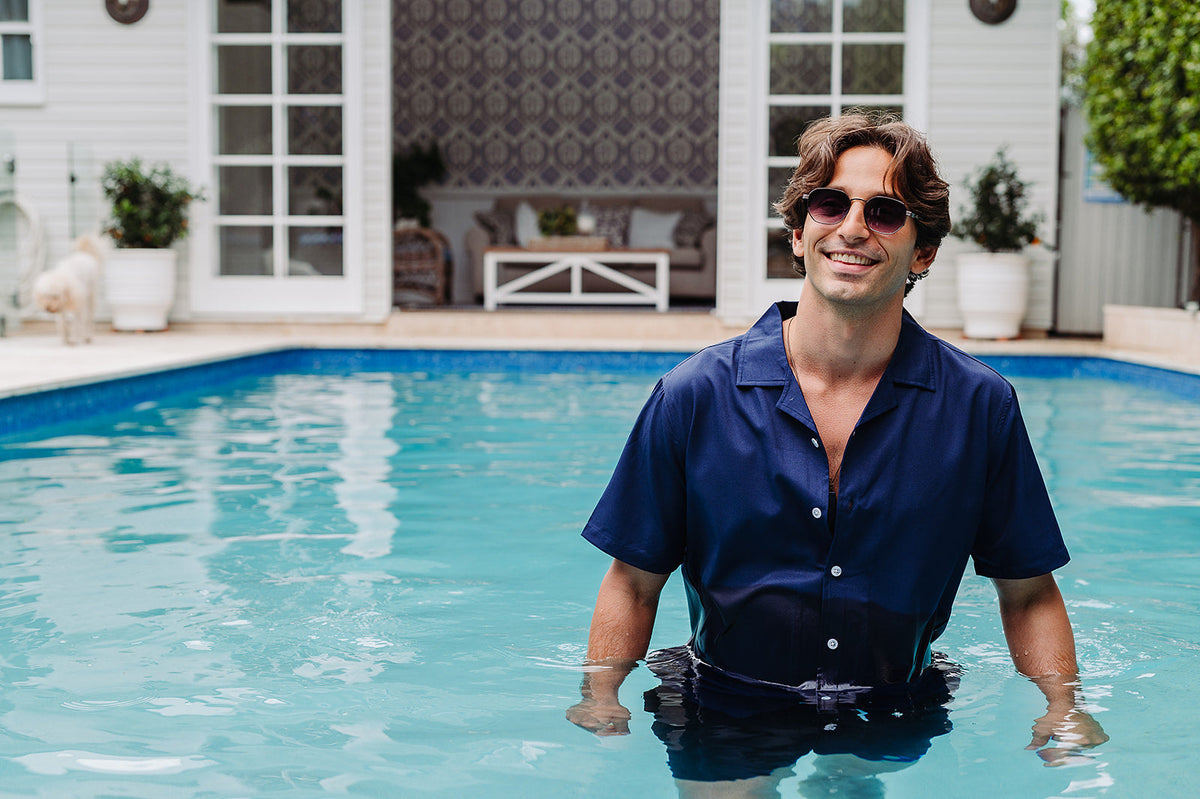 Man swimming in a navy blue Nashie